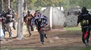 players running during paintball game