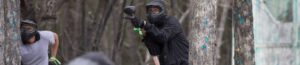 banner size of man shooting paintball